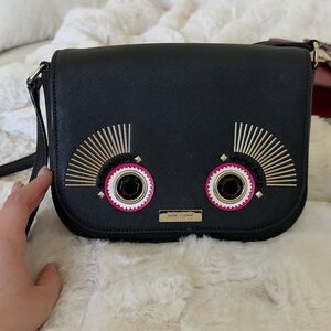 kate spade Black Crossbody Bag with Pink Eye Embellishments
